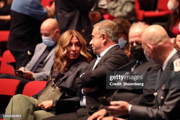 Carlos Ghosn, former Nissan chief executive officer, center, speaks with spouse Carole Ghosn before a roundtable event at St Joseph University in...