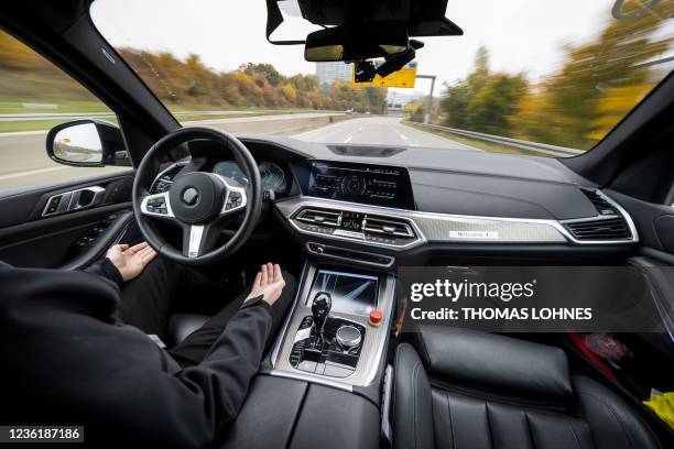 An employee of German auto parts manufacturer Continental AG, demonstrates an autonomously driving car in Frankfurt am Main, central Germany on...