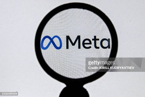 This photograph taken on October 28, 2021 shows the META logo on a laptop screen in Moscow as Facebook chief Mark Zuckerberg announced the parent...