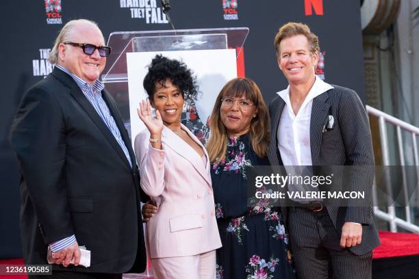 Manager John Carrabino , agents Lorrie Bartlett and Chuck James pose with actress-director Regina King at her Hand and Footprint Ceremony at the TCL...