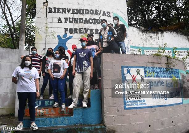 Cristina Navas poses with her students at the Forever Foundation in Soyapango, El Salvador on October 19, 2021. - Cristina, who lives in a populous...