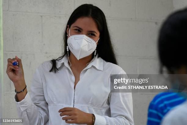 Marta Morales teaches at the Forever Foundation's in Soyapango, El Savador on October 19, 2021. - Marta, who lives in a populous neighborhood...