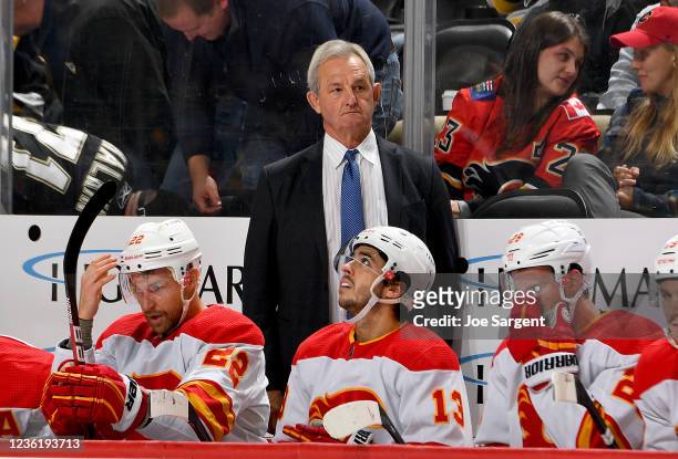 Darryl Sutter of the Calgary Flames looks on against the Pittsburgh Penguins at PPG PAINTS Arena on October 28, 2021 in Pittsburgh, Pennsylvania.