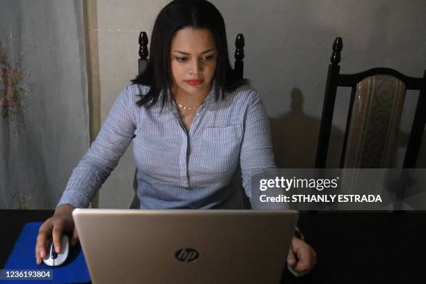 Cristina Navas takes a virtual class at her house in Soyapango, El Salvador on October 19, 2021. - Cristina, who lives in a populous neighborhood...