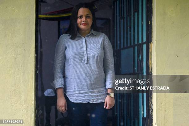 Cristina Navas poses at her house in Soyapango, El Salvador on October 19, 2021. - Cristina, who lives in a populous neighborhood besieged by gangs,...