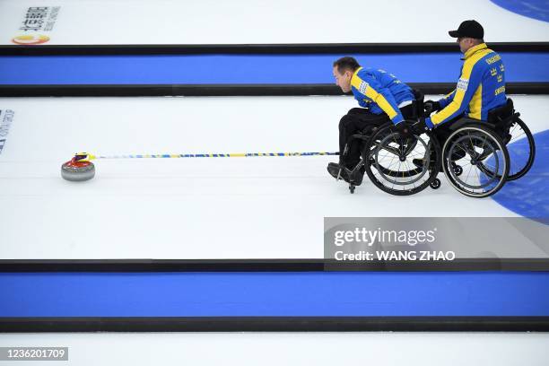 Sweden's Ronny Persson competes in the semi-final match between Sweden and Scotland during the World Wheelchair Curling Championship, part of a...