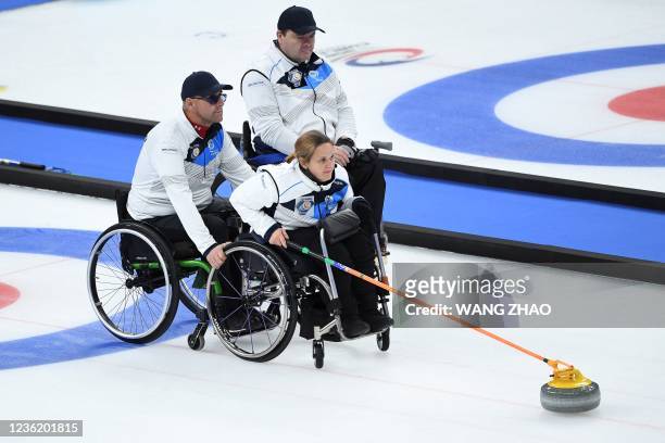 Scotland's Meggan Dawson Farrell pushes the stone in the semi-final match between Sweden and Scotland during the World Wheelchair Curling...