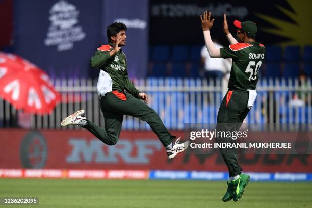 Bangladesh's Mahedi Hasan celebrates with teammate Soumya Sarkar after taking the wicket of West Indies' Chris Gayle during the ICC mens Twenty20...