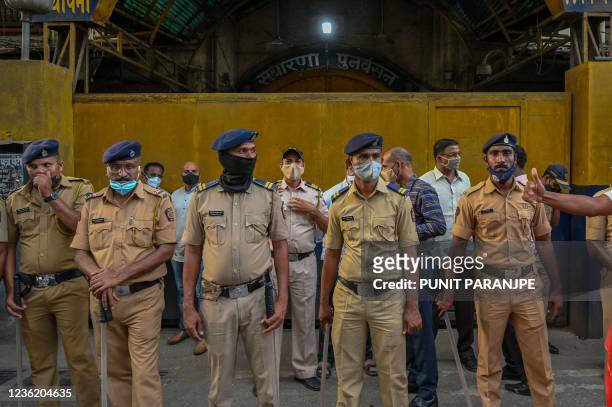 Police stand guard outside the Arthur Road Jail where Bollywood actor Shah Rukh Khan's son Aryan Khan, who was arrested in connection to a drug case,...