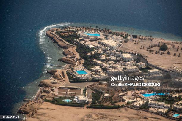 This picture taken on September 27, 2021 shows an aerial view of a luxury hotel complex in the Egyptian the Red Sea resort city of Sharm el-Sheikh at...