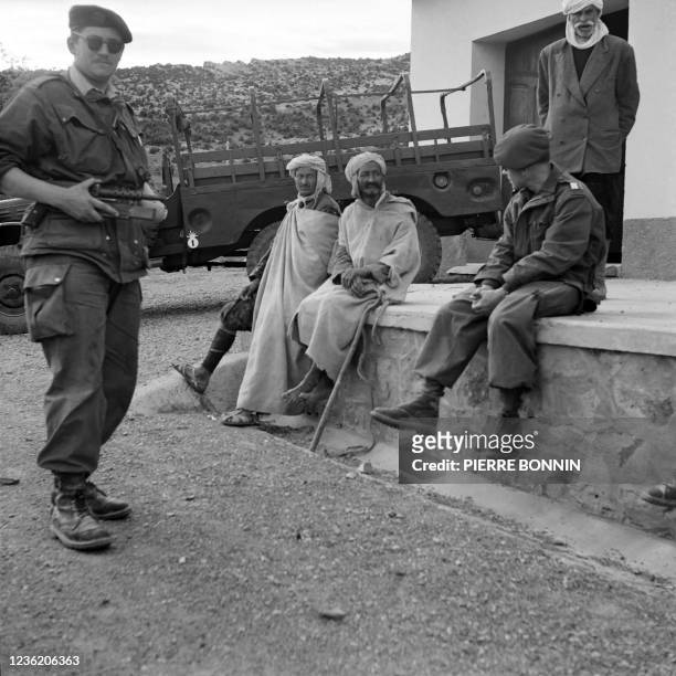 French army paratroopers question peasants on November 12, 1954 in the Aurès massif, where several skirmishes took place between French troops and...