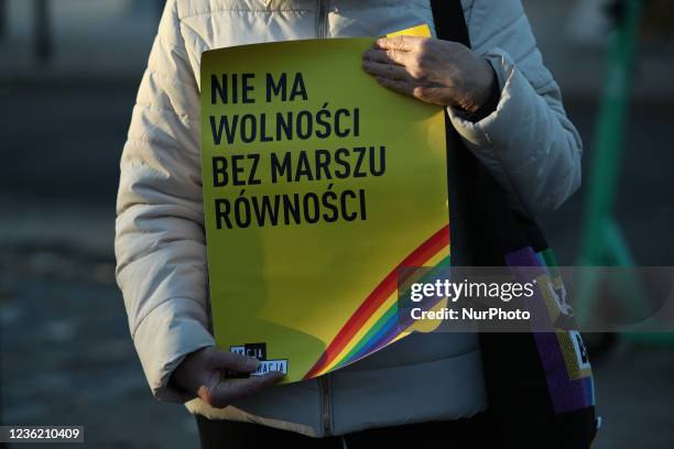 Woman holds a poster reading &quot;No freedom without equality marches&quot; during a rally in front of parliament on 29 October, 2021 to protest...