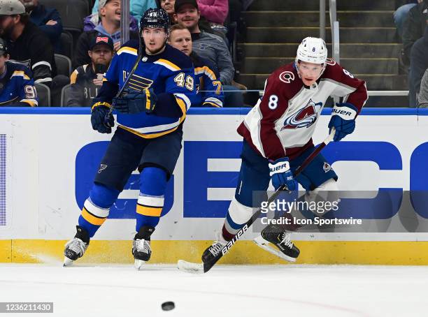 St. Louis Blues center Ivan Barbashev and Colorado Avalanche defenseman Cale Makar go after a loose puck during a NHL game between the Colorado...