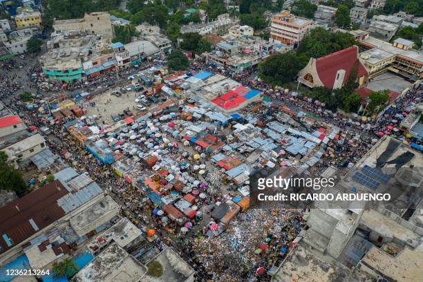 An aerial view shows a street market in Port-au-Prince, Haiti, on October 29, 2021. - Already burdened by months of political chaos and natural...