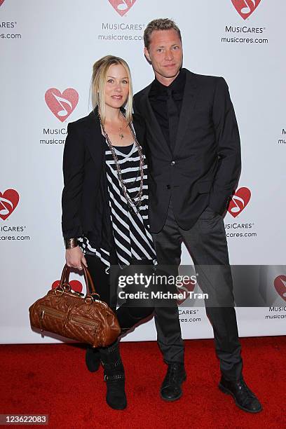 Christina Applegate and Martyn LeNoble arrive at the 7th Annual MusiCares MAP Fund benefit concert held at Club Nokia on May 6, 2011 in Los Angeles,...