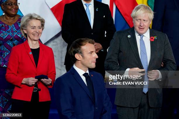 World Trade Organization Director-General Ngozi Okonjo-Iweala, European Commission President Ursula von der Leyen, French President Emmanuel Macron,...