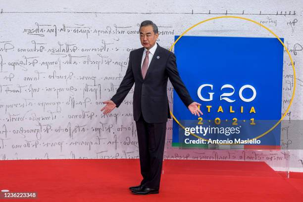 Italian Prime Minister Mario Draghi welcomes the China's Foreign Minister Wang Yi during the welcome ceremony on the first day of the Rome G20...