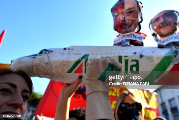 Employees of late Italian airline Alitalia take part in a protest against the G20 of World Leaders Summit on October 30, 2021 in the district of the...