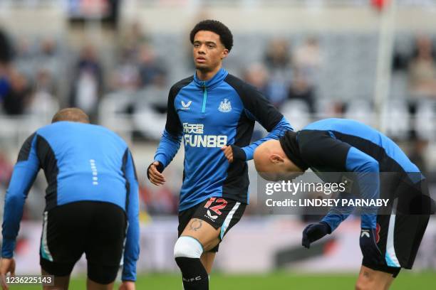 Newcastle United's English-born Northern Irish defender Jamal Lewis warms up ahead of the English Premier League football match between Newcastle...