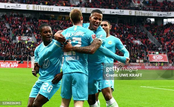 Wolfsburg's German midfielder Maximilian Arnold celebrates with Wolfsburg's German midfielder Ridle Baku , Wolfsburg's Belgian midfielder Aster...