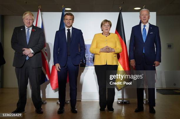 British Prime Minister Boris Johnson, French President Emmanuel Macron, German Chancellor Angela Merkel, and U.S. President Joe Biden, pose for the...