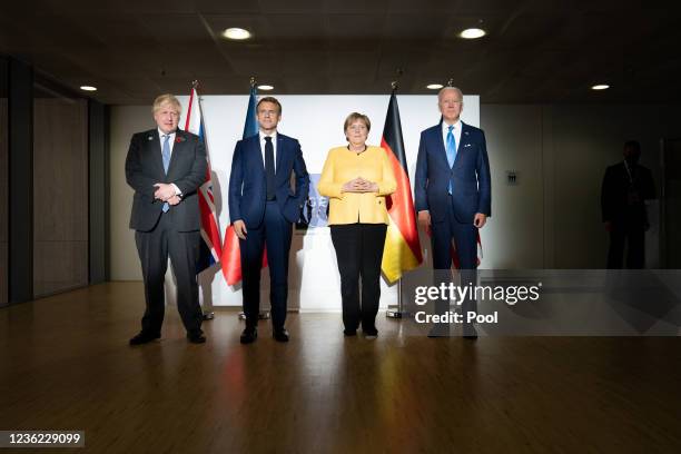 British Prime Minister Boris Johnson, French President Emmanuel Macron, German Chancellor Angela Merkel, and U.S. President Joe Biden, pose for the...