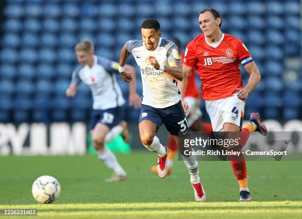 Preston North End's Scott Sinclair breaks under pressure from Luton Town's Kal Naismith during the Sky Bet Championship match between Preston North...
