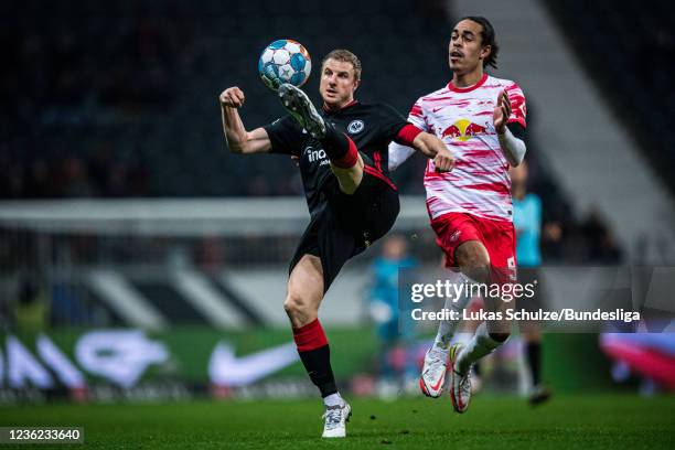 Martin Hinteregger of Frankfurt in action against Yussuf Poulsen of Leipzig during the Bundesliga match between Eintracht Frankfurt and RB Leipzig at...