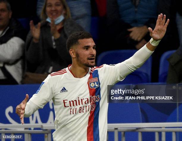 Lyon's French midfielder Houssem Aouar celebrates after scoring during the French L1 football match between Olympique Lyonnais and RC Lens at The...