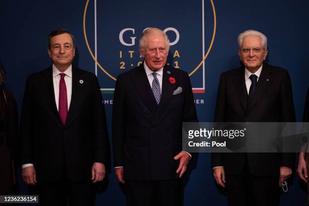 Prince Charles, Prince of Wales is greeted by Italian President Sergio Mattarella and Italian Prime Minister Mario Draghi as he arrives to attend a...