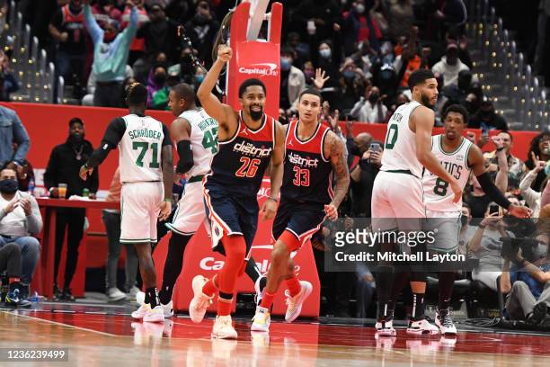 Spencer Dinwiddie of the Washington Wizards celebrates the winning shot in double overtime during a NBA basketball game against the Boston Celtics at...
