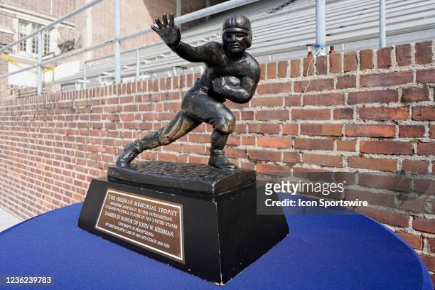 The Heisman Trophy sits on a table during the game between the Pennsylvania Quakers and the Brown Bears on October 30, 2021 at Franklin Field in...