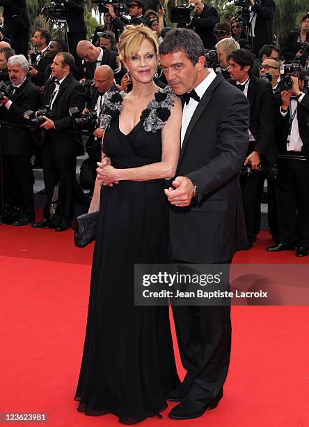 Melanie Griffith and Antonio Banderas arrive at the "Midnight In Paris" Premiere part of the 64th Cannes Film Festival at Palais des Festivals on May...