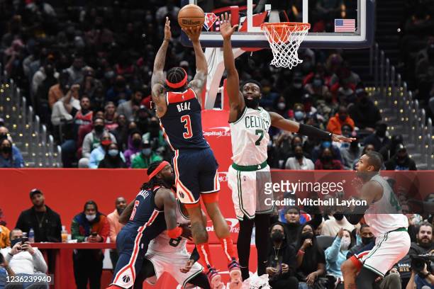 Bradley Beal of the Washington Wizards takes a shot over Jaylen Brown of the Boston Celtics in the fourth quarter during a NBA basketball game at...
