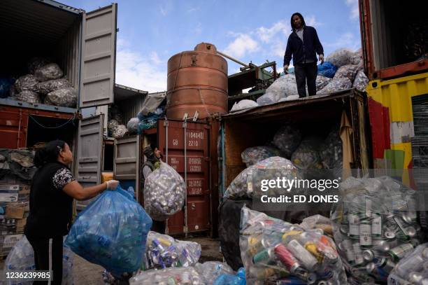 Canners' sort cans and bottles at non-profit recycling center 'Sure We Can' in Brooklyn on October 27, 2021. New York has an estimated 10,000...