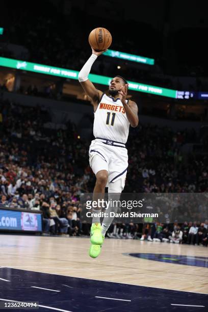 Monte Morris of the Denver Nuggets drives to the basket against the Minnesota Timberwolves on OCTOBER 30, 2021 at Target Center in Minneapolis,...