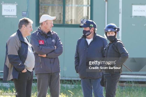 Trainer Tony Noonan talks with jockey Craig Williams during trackwork at Werribee Racecourse on October 31, 2021 in Werribee, Australia.