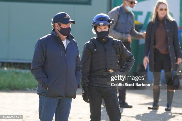 Trainer Tony Noonan talks with jockey Craig Williams during trackwork at Werribee Racecourse on October 31, 2021 in Werribee, Australia.