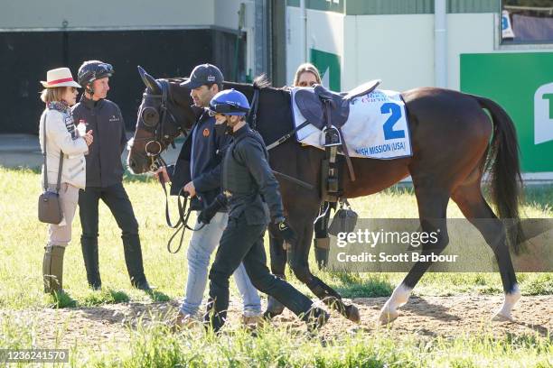 Trainer Gai Waterhouse and jockey Glen Boss look on as Spanish Mission and Craig Williams walk past during trackwork at Werribee Racecourse on...