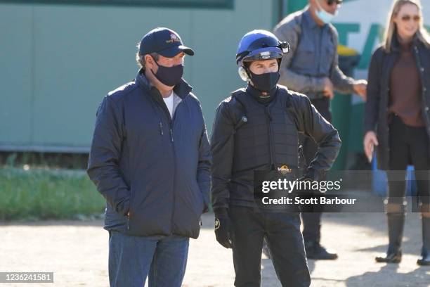 Trainer Tony Noonan talks with jockey Craig Williams during trackwork at Werribee Racecourse on October 31, 2021 in Werribee, Australia.