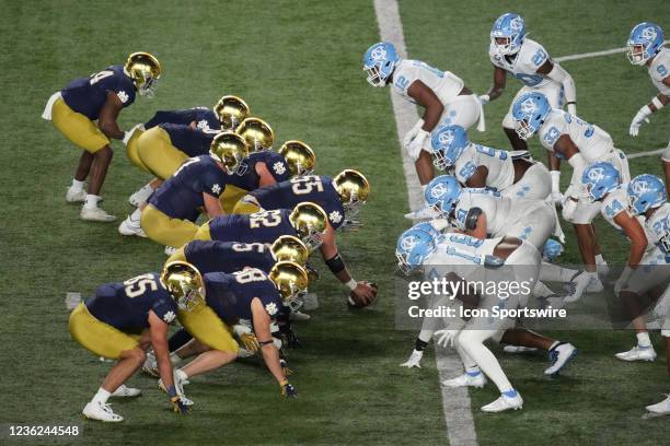 Notre Dame Fighting Irish offensive line lines up at one yard line across from the North Carolina Tar Heels defensive line during a game between the...