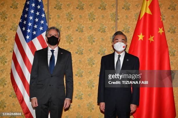 Secretary of State Antony Blinken and Chinese Foreign Minister, Wang Yi pose prior to their meeting on October 31, 2021 at a hotel in Rome on the...