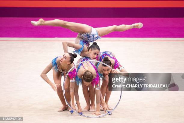 Team Italy compete in the group three hoops and two pairs of clubs final during the Rhythmic Gymnastics World Championships at the West Japan General...