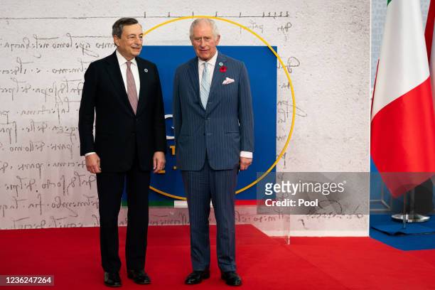 Prince Charles, Prince of Wales is greeted by Italian Prime Minister Mario Draghi as he arrives to attend the G20 Summit at the La Nuvola conference...