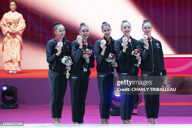 Silver medallists team Italy pose on the podium after the group five balls final during the Rhythmic Gymnastics World Championships at the West Japan...