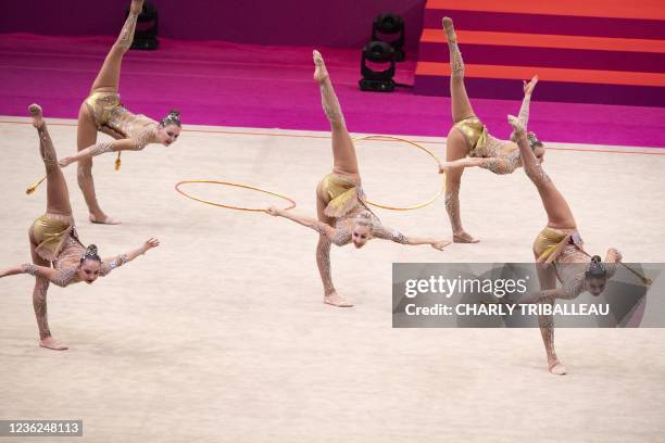 Team Russia compete in the group three hoops and two pairs of clubs final during the Rhythmic Gymnastics World Championships at the West Japan...