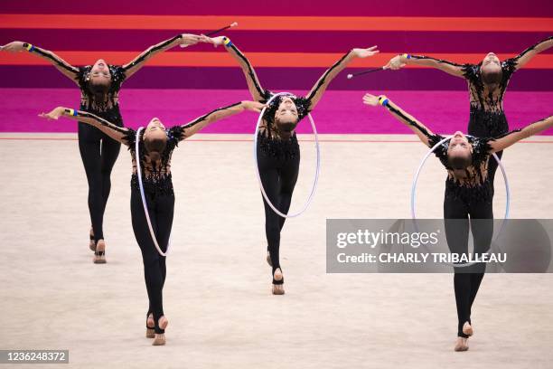 Team Ukraine compete in the group three hoops and two pairs of clubs final during the Rhythmic Gymnastics World Championships at the West Japan...