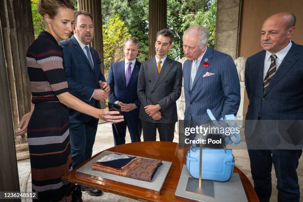 Prince Charles, Prince of Wales views The SMI Fashion Coalition's Digital ID, a virtual certificate that records each item's history with members of...