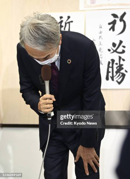 Nobuteru Ishihara, a former secretary general of the Liberal Democratic Party, bows to supporters after losing in his electoral district in Tokyo in...