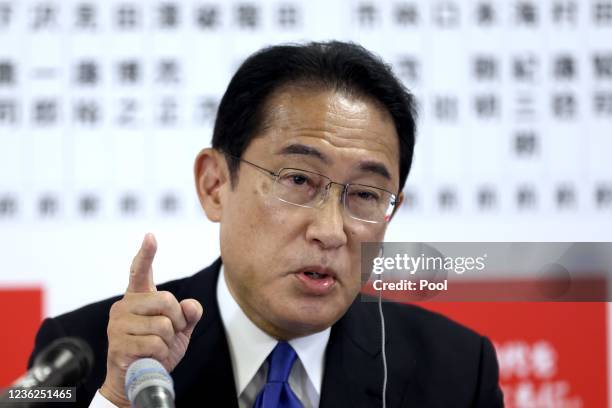 Japan's Prime Minister and ruling Liberal Democratic Party leader Fumio Kishida speaks as he joins a live interview with news channels individually...